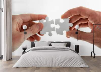 two hands holding jigsaw puzzle pieces representing collaboration partnership problem solving and fi Wall mural