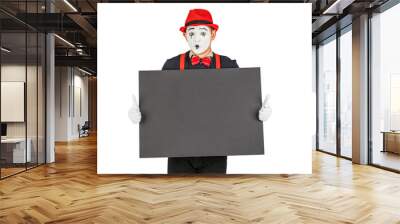 happy MIME artist holding a blank white Board, on a white background. Wall mural