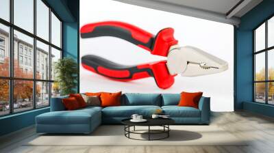 The pliers are red and black on a white background Wall mural