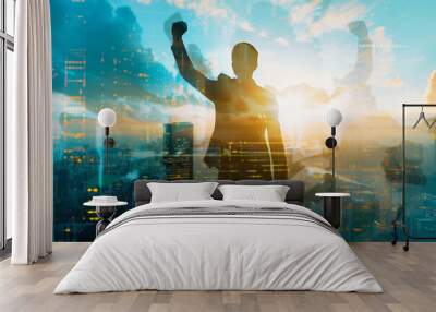 Double exposure of a businessman with a raised arm at sunrise overlaid on a cityscape, symbolizing modern life, business, and urban living. Wall mural