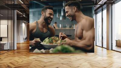 Happy sporty gay couple on fitness diet eating a healthy green salad with vegetables at gym canteen. Wall mural