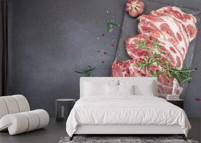 Raw pork neck meat. Chop steak, red peppercorn, garlic cloves, sea salt and fresh rosemary Wall mural