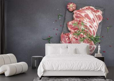 Raw pork neck meat. Chop steak, red peppercorn, garlic cloves, sea salt and fresh rosemary Wall mural