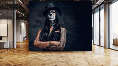 A girl in stylish top hat with skull make up. Wall mural