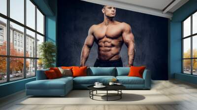 A handsome power athletic man with the muscular body Wall mural