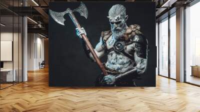 Bringer of the death king with pale skin holding two handed axe and looking down in dark background. Wall mural