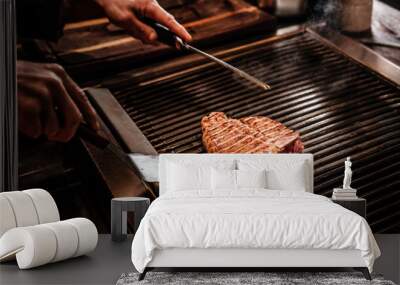 Close-up image of a cooking delicious meat steak on a grill Wall mural