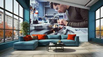 Electronic technician working in the modern repair shop Wall mural