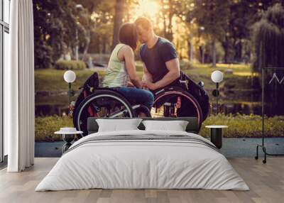 handicapped young couple on two wheelchairs. Wall mural