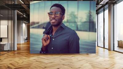 portrait of casual black male in a city. Wall mural