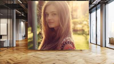 Portrait of long hair female in a park. Wall mural