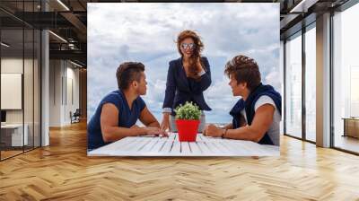 Redhead woman and two guys. Wall mural