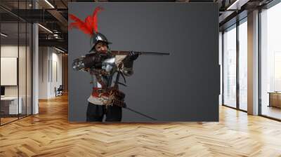 Studio shot of french rifleman dressed in plate armour aiming flintlock rifle. Wall mural