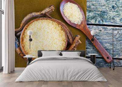 Rice in a wooden bowl and a wooden spoon Wall mural