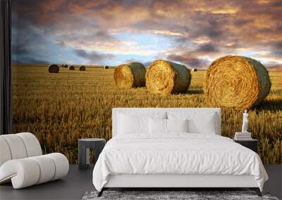 Straw rolls and dramatic sky Wall mural