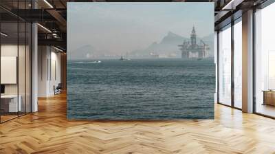 Oil extraction platform in the sea surrounded by hills in Rio de Janeiro in Brazil Wall mural