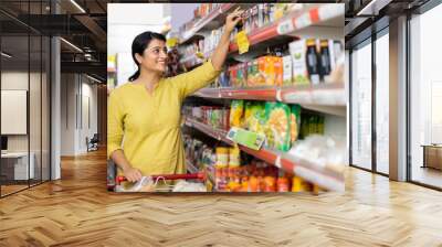 Indian woman shopping at grocery store Wall mural