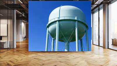 Water tower with blue sky in the background  Wall mural