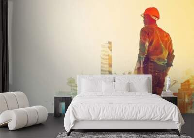 A man in a hard hat stands in front of a city skyline Wall mural