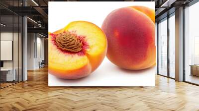 A ripe peach, with its fuzzy skin and juicy orange flesh, whole and sliced, isolated on a white background Wall mural