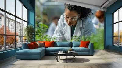 Researchers in lab coats taking notes on cannabis plant growth Wall mural