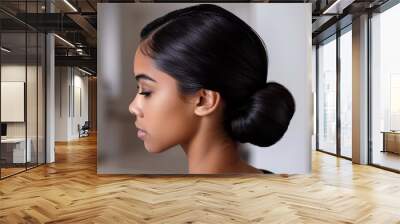 Stylist creating a sleek, low bun for a sophisticated look Wall mural