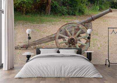 Old wooden cannon. Close-up of a military cannon used in the 16th and 17th centuries. Wall mural