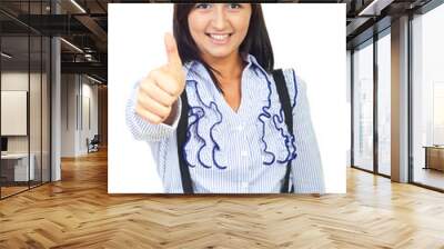 Cheerful young woman giving thumbs Wall mural