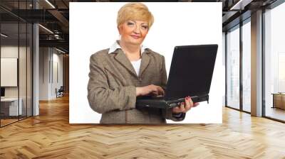 smiling mature business woman with laptop Wall mural