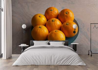 Fruit plate with oranges on a dining table for healthy dish Wall mural