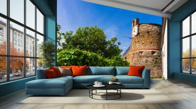 The clock tower of the Castle of Riomaggiore (Castello di Riomaggiore), one of the most important historical landmarks in Cinque Terre, Italy, on a beautiful summer day. Wall mural