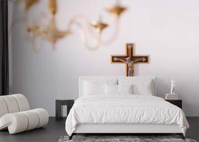 Crucifix with Jesus on white wall. Wall mural