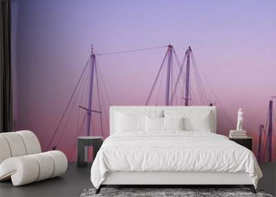 boat masts under a pink and orange sunset Wall mural