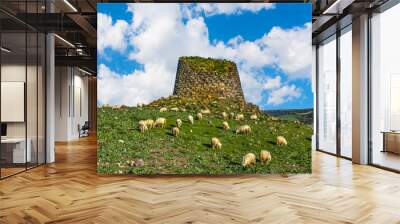 Herd of sheep by a nuraghe in Sardinia Wall mural