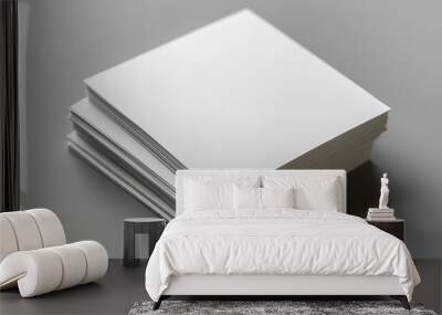 Top view of two white open paper cards on a gray background with soft shadows and space for text Wall mural