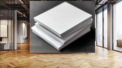 Top view of two white open paper cards on a gray background with soft shadows and space for text Wall mural