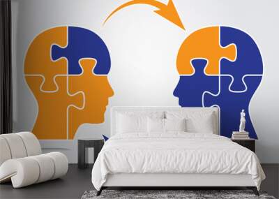 Two human heads with puzzle pieces and arrows sharing business information. Brainstorming concept vector illustration with orange and blue puzzle pieces. Information sharing, teamwork concept graphic. Wall mural