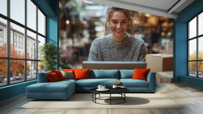 Smiling Woman Working on Laptop in a Cafe Wall mural