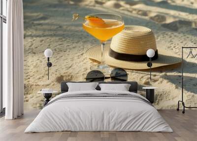 Straw hat with sunglasses on sand beach Wall mural