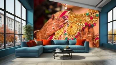 Indian bride wearing heavy jewellery traditional gold necklace, wedding day Wall mural