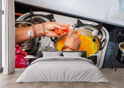 Top View Of Indian/Asian Woman Cooking, working in kitchen, lock down due to covid-19.coronavirus. Wall mural