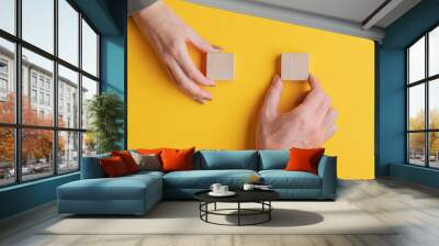 Blank wooden blocks on bright yellow background Wall mural