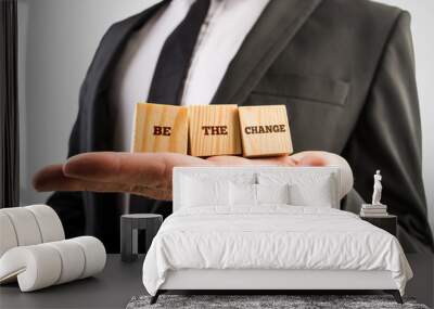 Closuep of a professional adviser holding three wooden cubes in Wall mural