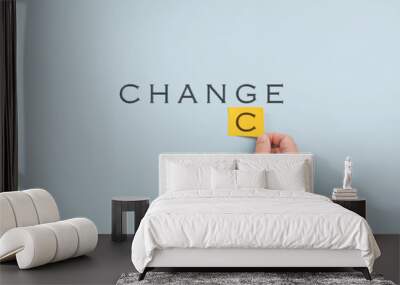 Male hand changing the word Change into Chance Wall mural