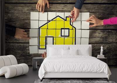 Top view of a group of six people, man and women, assembling a y Wall mural