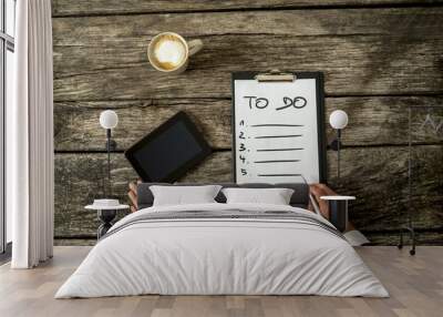 Top view of male hand writing a To do list on a white sheet of p Wall mural