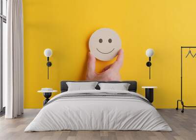 Wooden cut circle with smiling face on it Wall mural