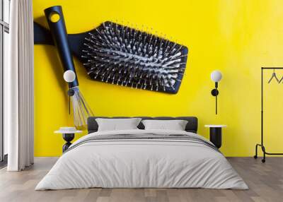 Hairbrush and special tool will help remove tangles and dust stuck between the teeth or bristles. Yellow background. Top view. Wall mural