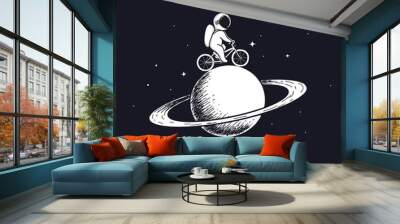 Cute astronaut rides on bicycle at the Saturn.Prints design.Childish vector illustration Wall mural