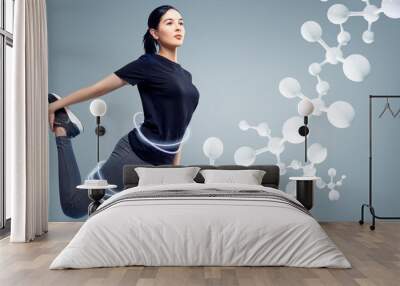 Sporty girl among white molecules. Good metabolism concept. Wall mural